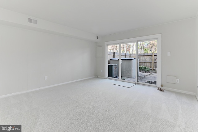 unfurnished living room with baseboards, carpet flooring, and visible vents
