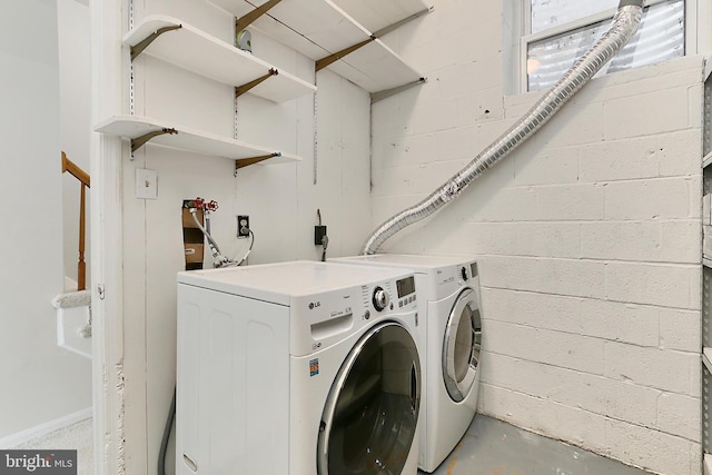 laundry area with washing machine and dryer and laundry area
