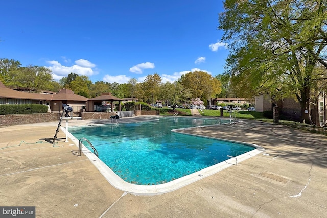 pool featuring a gazebo and a patio