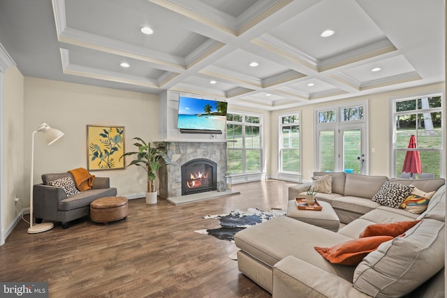 living room with hardwood / wood-style floors, coffered ceiling, a stone fireplace, beamed ceiling, and baseboards