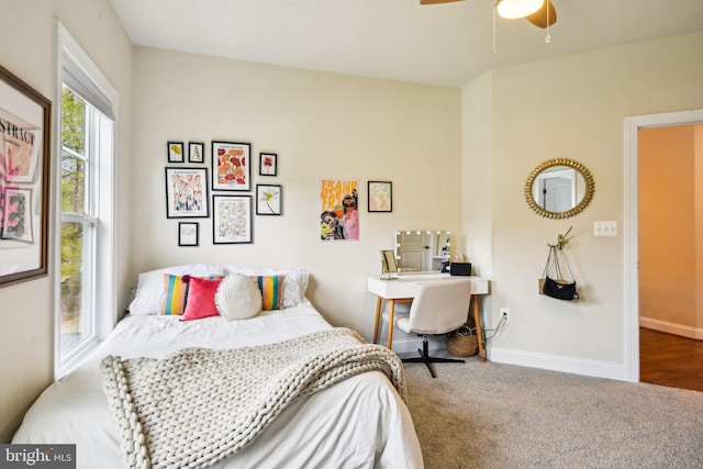 bedroom with carpet floors, baseboards, and ceiling fan