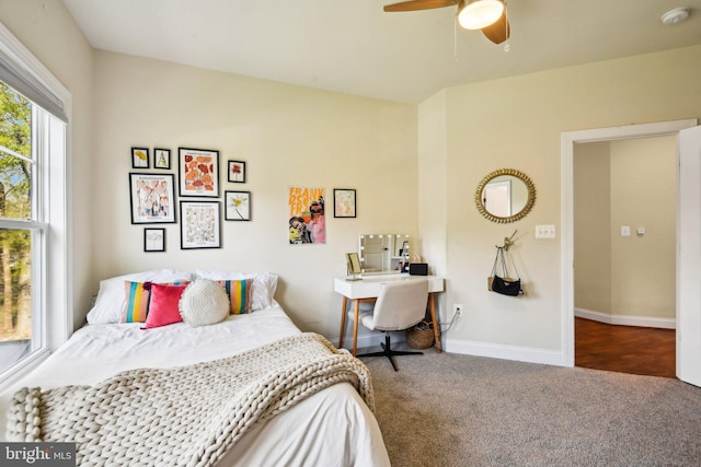 bedroom with carpet flooring, baseboards, and a ceiling fan