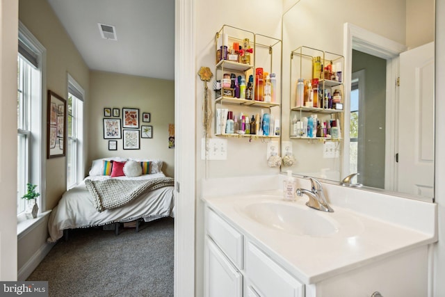 bathroom featuring vanity and visible vents