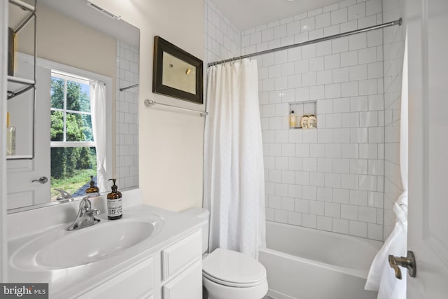 bathroom featuring shower / bath combo, toilet, vanity, and visible vents