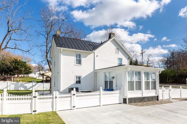 548 Uniontown Rd, Westminster, MD 21158 - exterior space with a gate, a chimney, and a fenced front yard