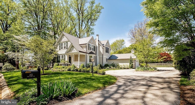 213 Pine Tree Rd, Wayne, PA 19087 - shingle-style home with a front yard and asphalt driveway