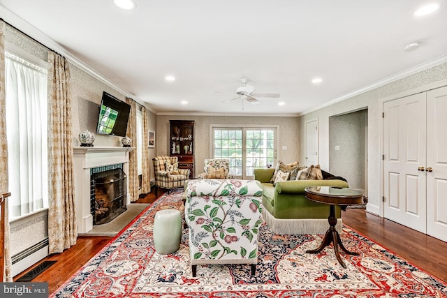 213 Pine Tree Rd, Wayne, PA 19087 - living room with crown molding, wood finished floors, a fireplace, a ceiling fan, and recessed lighting