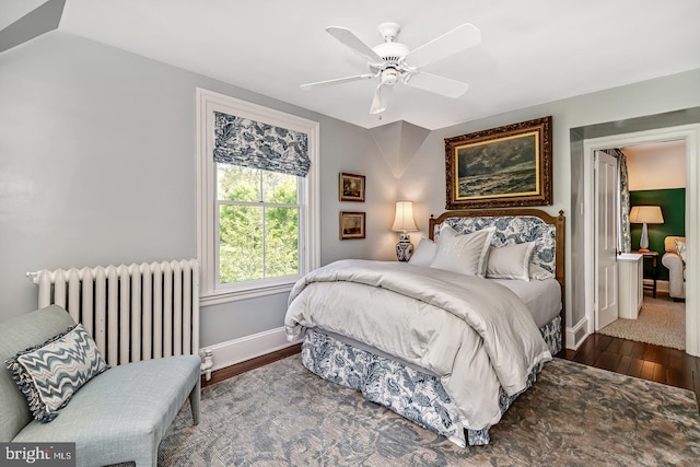 213 Pine Tree Rd, Wayne, PA 19087 - bedroom featuring radiator heating unit, wood finished floors, and ceiling fan