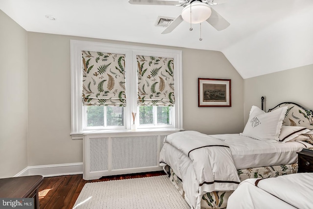 213 Pine Tree Rd, Wayne, PA 19087 - bedroom with wood finished floors, lofted ceiling, radiator, and a ceiling fan