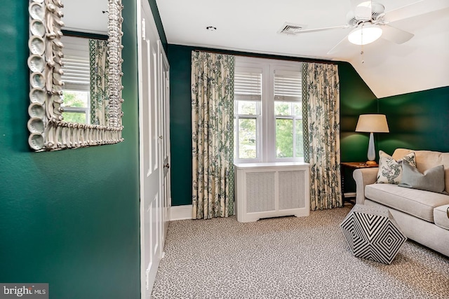 213 Pine Tree Rd, Wayne, PA 19087 - carpeted living room featuring radiator heating unit, vaulted ceiling, and ceiling fan