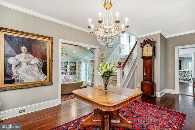 213 Pine Tree Rd, Wayne, PA 19087 - dining space with dark wood-type flooring, a chandelier, crown molding, and stairs