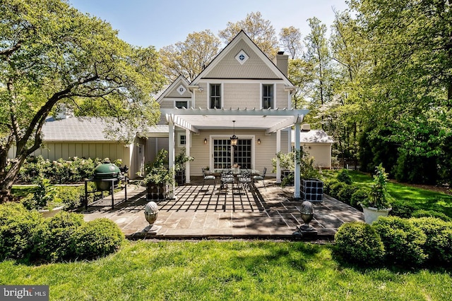 213 Pine Tree Rd, Wayne, PA 19087 - back of property with a pergola, a chimney, and a patio area