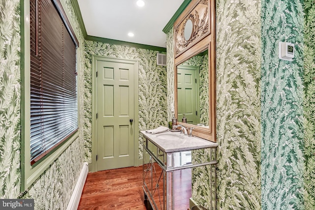 213 Pine Tree Rd, Wayne, PA 19087 - bathroom with wallpapered walls, wood finished floors, vanity, recessed lighting, and ornamental molding