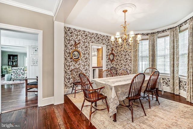 213 Pine Tree Rd, Wayne, PA 19087 - dining space featuring a chandelier, ornamental molding, wood finished floors, and wallpapered walls
