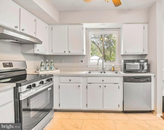 13059 Open Hearth Way, Germantown, MD 20874 - kitchen with appliances with stainless steel finishes, a sink, light countertops, under cabinet range hood, and white cabinetry