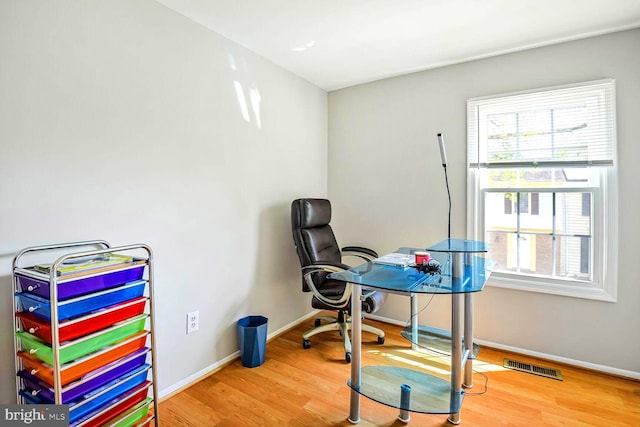 13059 Open Hearth Way, Germantown, MD 20874 - office area with visible vents, wood finished floors, and a healthy amount of sunlight