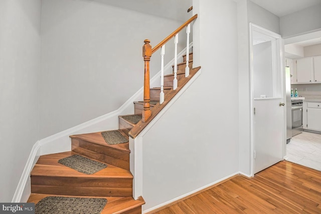 13059 Open Hearth Way, Germantown, MD 20874 - stairs featuring baseboards and wood finished floors