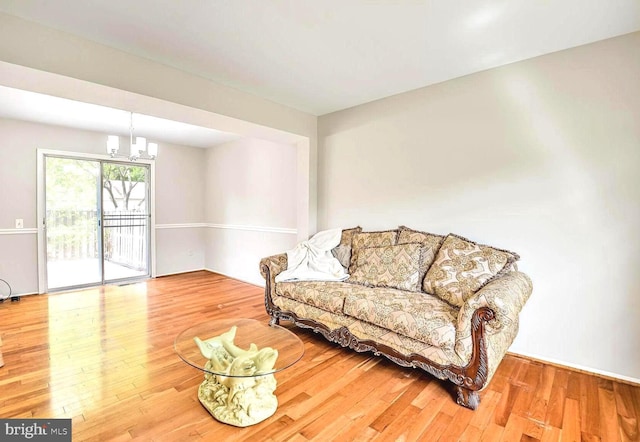 13059 Open Hearth Way, Germantown, MD 20874 - sitting room featuring an inviting chandelier and wood finished floors