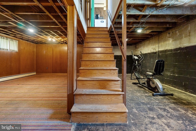 stairs with a baseboard heating unit