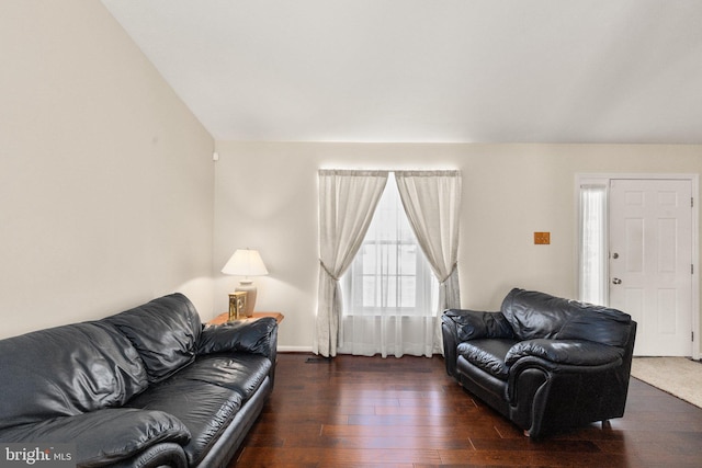 living room featuring wood-type flooring and baseboards