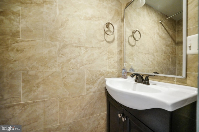 4517 Springfield Ave, Philadelphia, PA 19143 - bathroom featuring tasteful backsplash, vanity, and tile walls