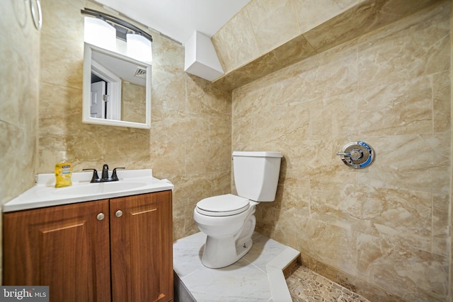4517 Springfield Ave, Philadelphia, PA 19143 - full bath with toilet, vanity, a tile shower, and tile walls