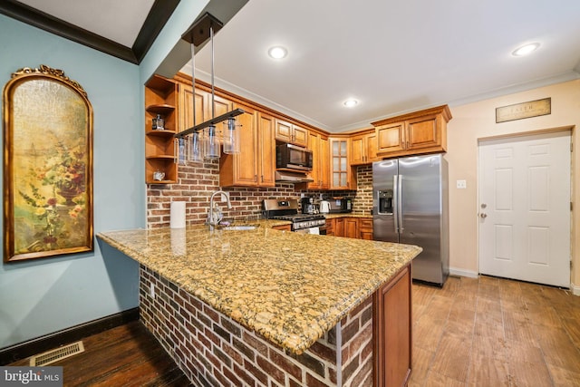 4517 Springfield Ave, Philadelphia, PA 19143 - kitchen with light stone countertops, a sink, visible vents, and stainless steel appliances