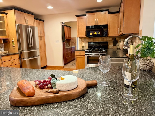 307 Homestead Rd, Hershey, PA 17033 - kitchen featuring decorative backsplash, recessed lighting, dark stone countertops, and appliances with stainless steel finishes