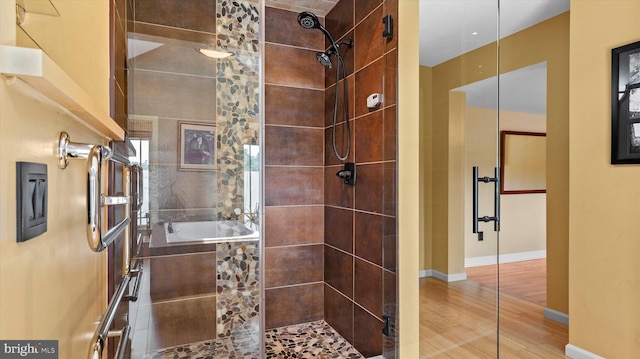 307 Homestead Rd, Hershey, PA 17033 - bathroom with a tile shower and wood finished floors