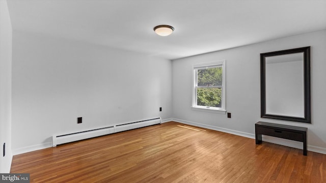 307 Homestead Rd, Hershey, PA 17033 - empty room with baseboards, wood finished floors, and baseboard heating