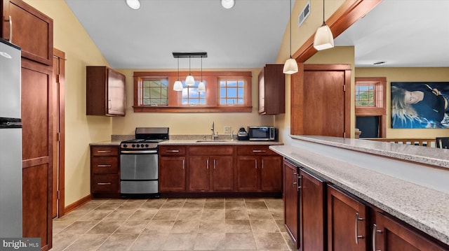 307 Homestead Rd, Hershey, PA 17033 - kitchen with hanging light fixtures, a sink, lofted ceiling, appliances with stainless steel finishes, and visible vents