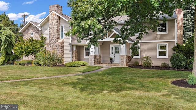 307 Homestead Rd, Hershey, PA 17033 - view of front of property featuring a chimney, a front lawn, and stone siding