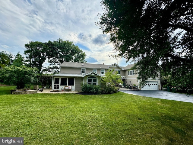 307 Homestead Rd, Hershey, PA 17033 - view of front of home featuring a garage, a sunroom, a front lawn, and driveway