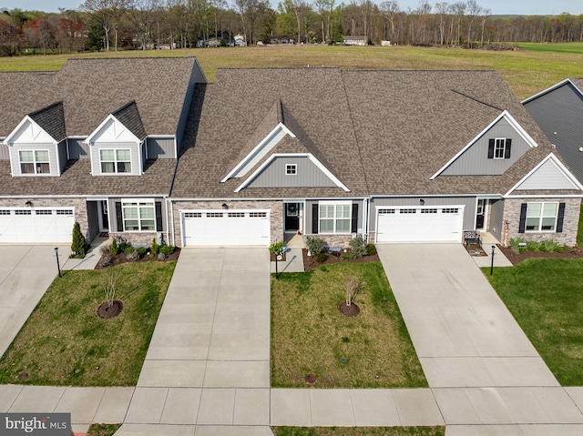 2537 Monarch Way, Bel Air, MD 21015 - view of front of house with driveway, stone siding, board and batten siding, and a front yard