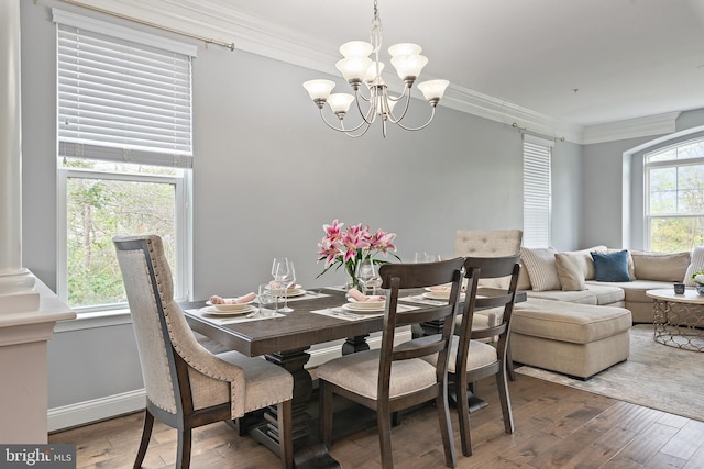 1614 Belle Dr, Annapolis, MD 21401 - dining room featuring an inviting chandelier, baseboards, hardwood / wood-style floors, and crown molding