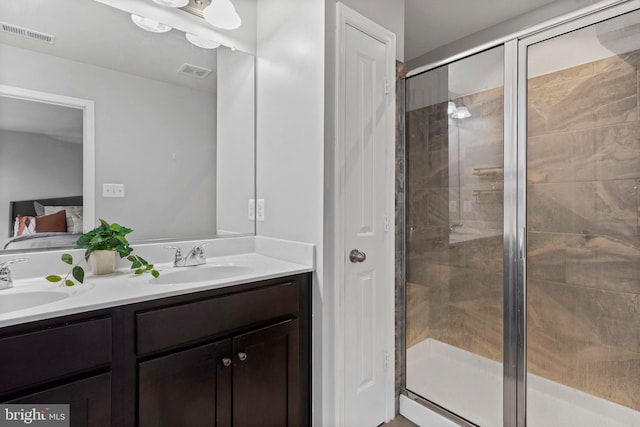 1614 Belle Dr, Annapolis, MD 21401 - bathroom featuring visible vents, a sink, and a stall shower