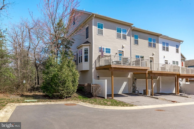 1614 Belle Dr, Annapolis, MD 21401 - rear view of property featuring a garage and aphalt driveway
