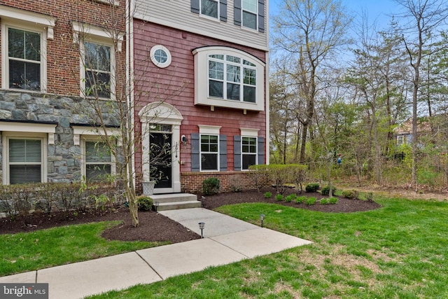 1614 Belle Dr, Annapolis, MD 21401 - doorway to property featuring stone siding and a lawn