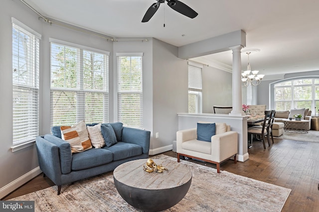 1614 Belle Dr, Annapolis, MD 21401 - living area with ornate columns, ceiling fan with notable chandelier, wood-type flooring, and a wealth of natural light