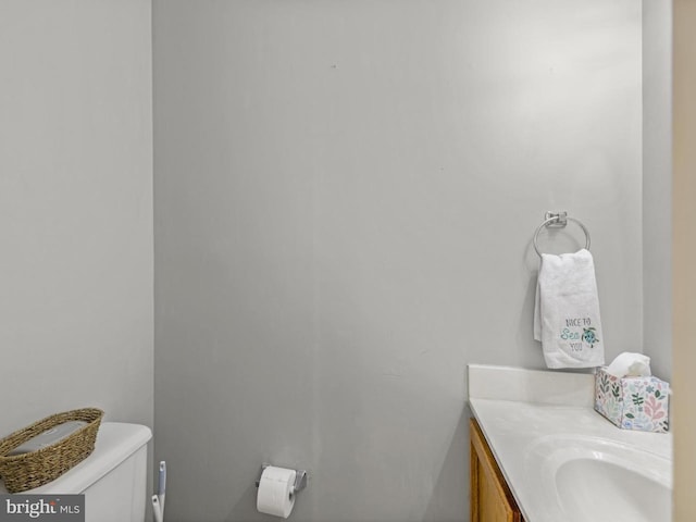 bathroom with toilet and vanity