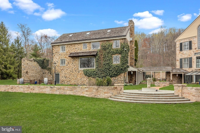 6068 Stoney Hill Rd, New Hope, PA 18938 - back of house featuring a lawn and stone siding
