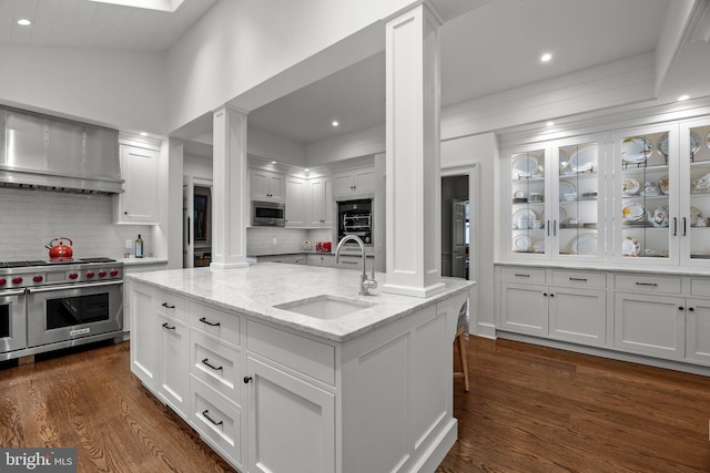 6068 Stoney Hill Rd, New Hope, PA 18938 - kitchen with wall chimney range hood, a sink, white cabinets, appliances with stainless steel finishes, and dark wood-style floors
