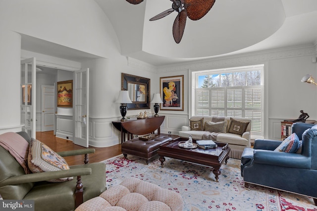 6068 Stoney Hill Rd, New Hope, PA 18938 - living room with wood finished floors, a ceiling fan, ornamental molding, a decorative wall, and wainscoting