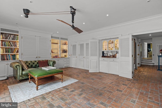 6068 Stoney Hill Rd, New Hope, PA 18938 - living area with crown molding, brick floor, and recessed lighting