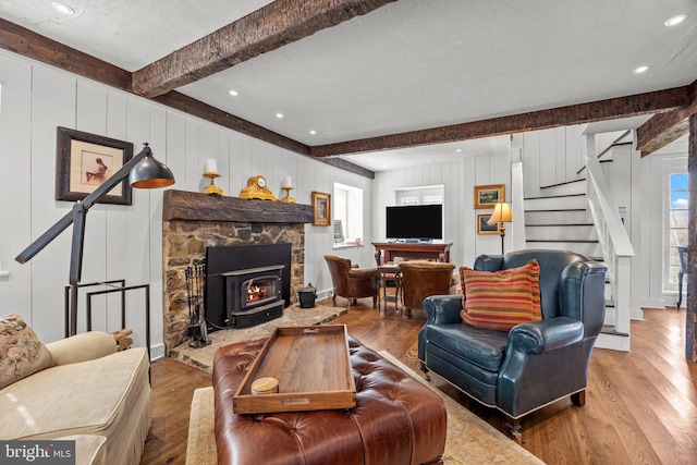 6068 Stoney Hill Rd, New Hope, PA 18938 - living area featuring beamed ceiling, wood finished floors, stairway, and a decorative wall