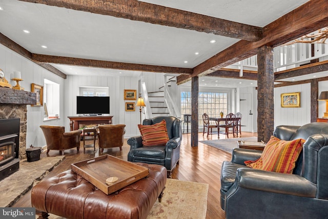 6068 Stoney Hill Rd, New Hope, PA 18938 - living area featuring stairway, wood finished floors, beam ceiling, and wooden walls