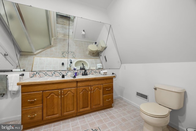 6068 Stoney Hill Rd, New Hope, PA 18938 - bathroom featuring double vanity, visible vents, toilet, a sink, and baseboards