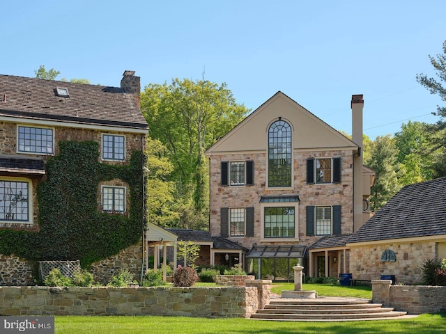 6068 Stoney Hill Rd, New Hope, PA 18938 - rear view of property featuring a pergola, stone siding, and a chimney