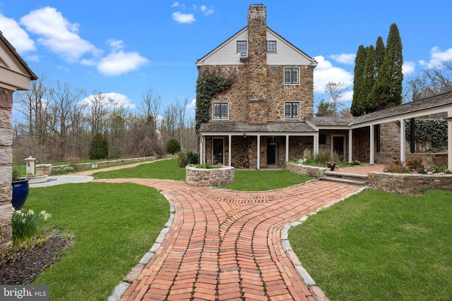 6068 Stoney Hill Rd, New Hope, PA 18938 - back of house featuring a yard, a porch, and stone siding