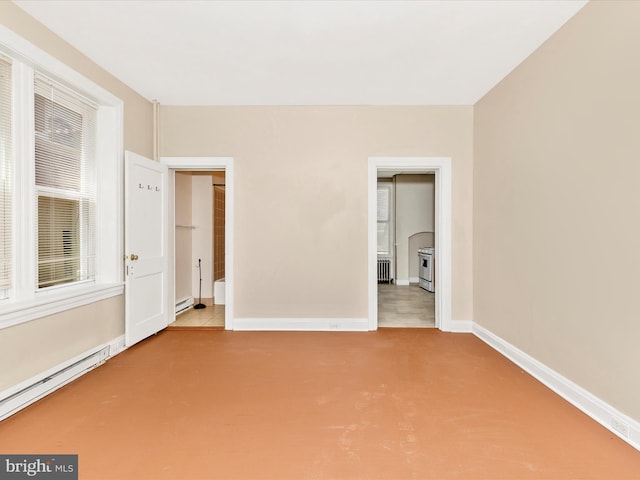 unfurnished bedroom featuring radiator heating unit, baseboards, baseboard heating, and carpet
